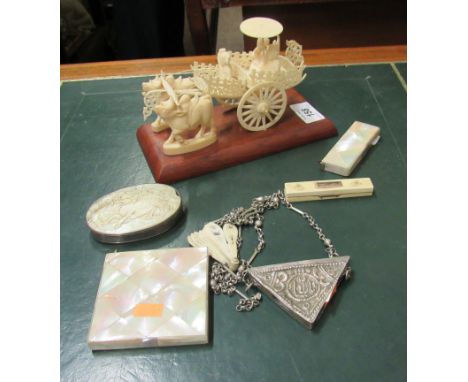 An antique carved ivory Buffalo Carriage with figures, some mother-o-pearl items, and some other ivory and silver plated item