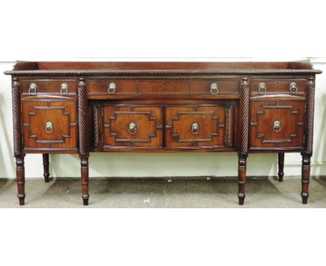 A good early 19th Century Irish Nelson Sideboard, the rectangular top with low back rail, and roped edge, and with matching h