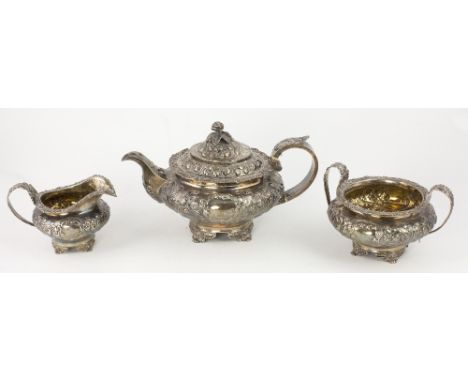 A very good George IV embossed English silver three piece Tea Service, with overall decoration of flowers, leaves etc., with 