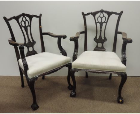 A pair of finely carved Chippendale style mahogany Armchairs, with pierced splats, on front carved legs with ball n' claw fee