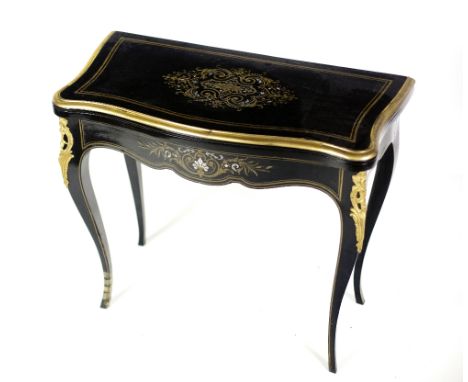 An attractive 19th Century French serpentine shaped ebony Card Table, the shaped top with decorative brass and mother-o-pearl