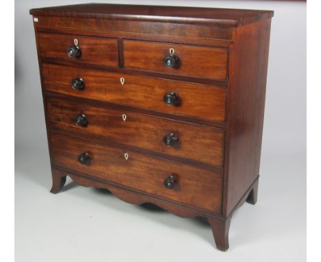 An attractive early 19th Century inlaid mahogany Chest, of two short and three long drawers with ivory escutcheons, and turne