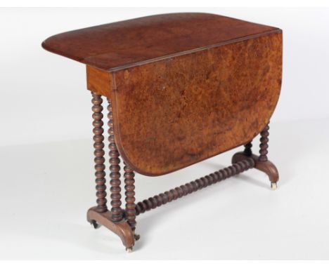 A good Victorian figured burr walnut Sutherland Table, on bobbin turned supports with out turned legs. (1)