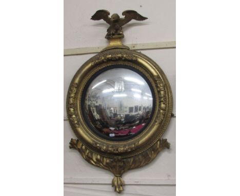 A magnificent Regency period Convex Mirror, with carved eagle surmounted, the circular surround with egg and dart moulding, w