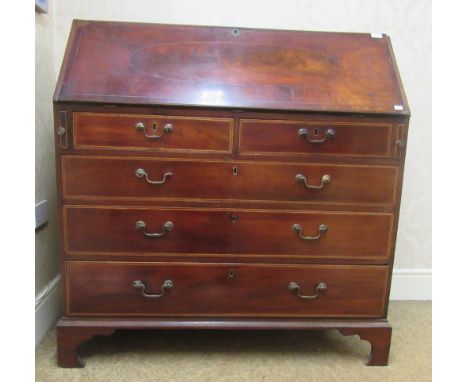 A good quality Georgian period inlaid mahogany Writing Bureau, the segmented drop front revealing a fitted inlaid interior wi