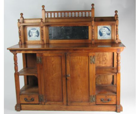 An attractive carved and turned oak English Arts & Crafts period Sideboard, possibly by Morris & Co., the shaped turned rail 