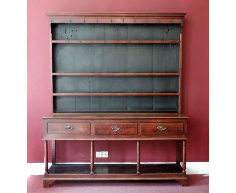 A very good quality late 18th Century / early 19th Century Welsh oak Dresser, with shelf back over a base with three frieze d