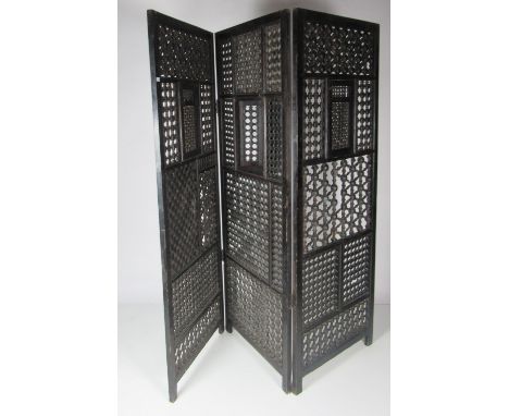 An unusual Syrian carved and bobbin turned Arabesque three fold ebonised Screen, with pierced decoration, 76" high x 84" wide