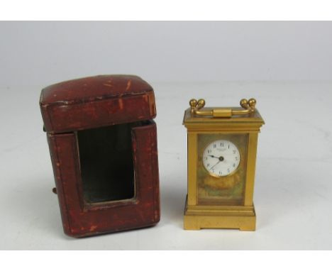 A rare heavy brass Miniature Carriage Clock, the small enamel dial signed Henry Capt., Geneva, in original crimson morocco ca