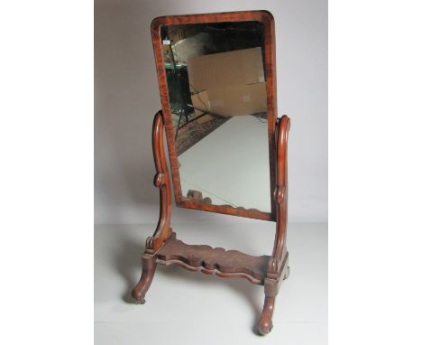 A fine early Victorian figured mahogany Cheval Mirror, on scroll supports, and base with four out-splayed legs. (1)Provenance