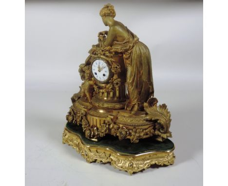 An impressive 19th Century French Mantle Clock, with figures surmounted, the circular white enamel dial with blue Roman numer
