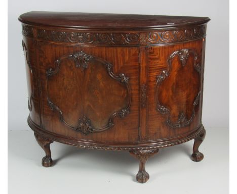 An attractive 20th Century carved and finely figured mahogany demi-lune Commode, in the manner of Thomas Chippendale by Warin