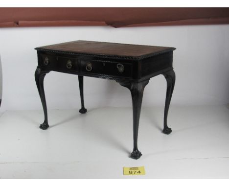 A Chippendale style bow fronted Writing Table, with leather inset top, two frieze drawers on ball n'claw feet. (1)Provenance 