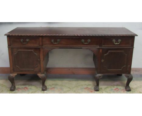 A good quality carved Chippendale style Irish mahogany Sideboard, with rope edge, three frieze drawers, open centre and two s