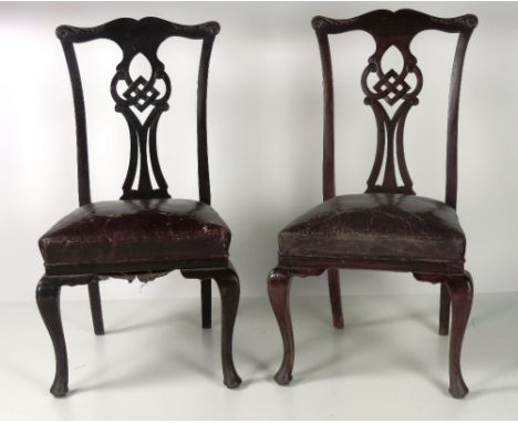 A set of 6, late 19th Century Chippendale style Dining Chairs, with carved and pierced backs, on front cabriole legs, covered
