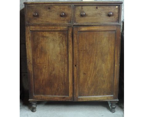 A mahogany Linen Press, possibly Irish, with two frieze drawers over two large panel doors, on turned feet, approx. 136cms (5