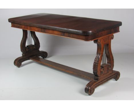 A Regency period inlaid rosewood and assimilated rosewood rectangular Sofa Table, of narrow proportions, the two large carved