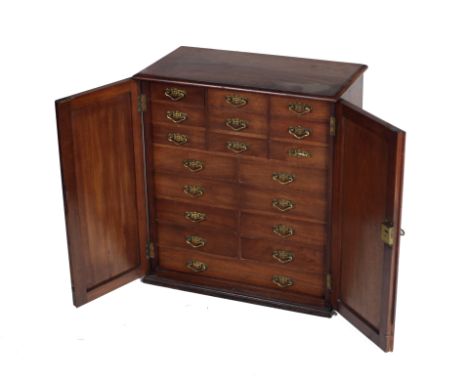 An attractive late 19th Century walnut Collectors Table Cabinet, with two linen fold type panel doors, and with an arrangemen