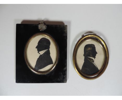 Silhouettes: a large head and shoulder "Portrait of a Gentleman, facing left, approx. 9cms (3 1/2"), in black and brass rimme