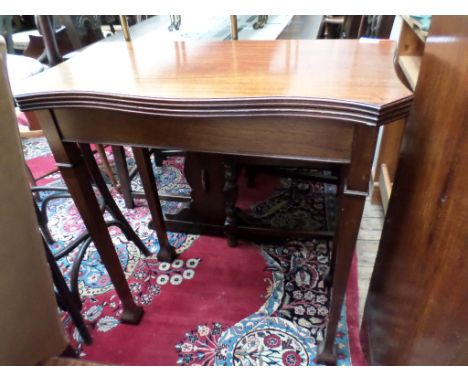Mahogany fold-over, single gate card table. The interior with green baize playing service on tapering ball feet