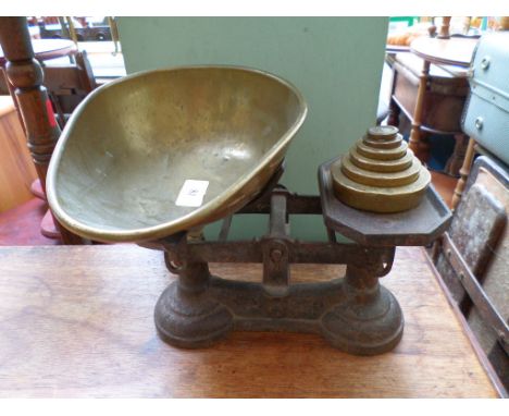 Set of scales including brass pan and six brass graduated weights