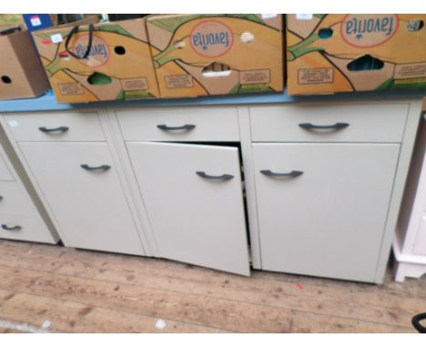 A cabinet in similar style and comprising of 3 shelved cupboards and 3 grey upper drawers with matching light blue mottled fo