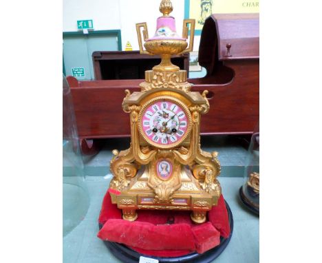 Most decorative French late 19th century mantel clock with pink ground porcelain dial and finial inlaid cameos, the ornately 