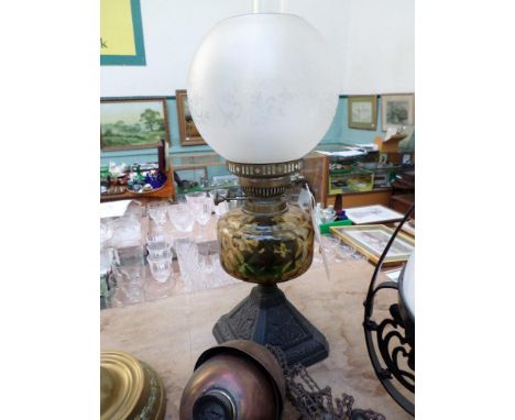 Victorian oil lamp with domed etched glass shade, light green bowl on shaped metal plinth