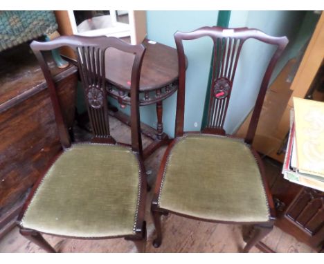 A pair of mahogany framed bedroom chairs with 6 vertical sprats to back, padded seat of each upholstered in light green studd