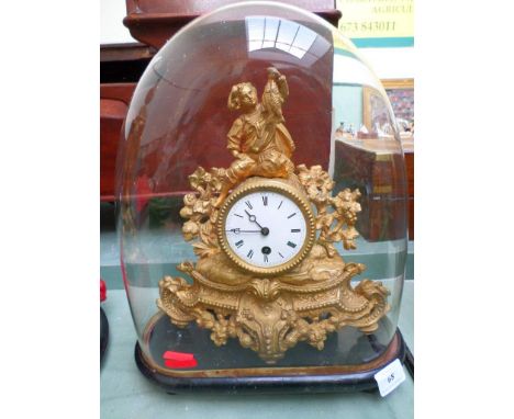 Gilded mantel clock with circular enamel dial painted roman numerals on oval plinth within domed glass case