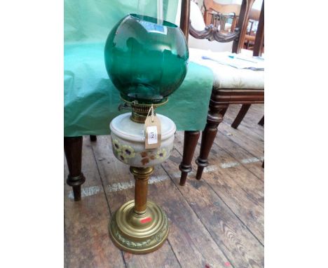 Circular brass based paraffin table lamp with painted lilac bowl and green shade