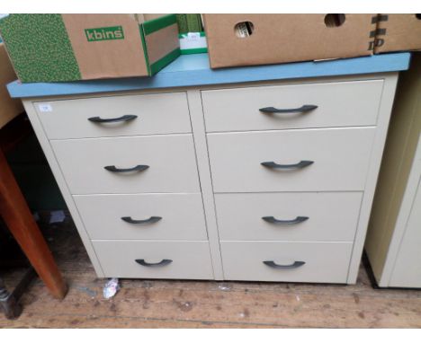 Mid-twentieth century grey metal nest of 8 drawers, the top in mottled light blue formica