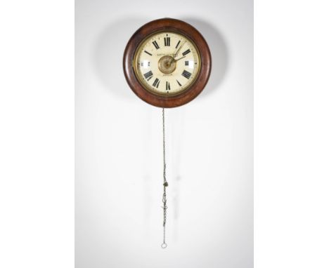 A MAHOGANY FRAMED WALL CLOCK, signed Canter Brothers, Dublin; and a mantel clock (2)