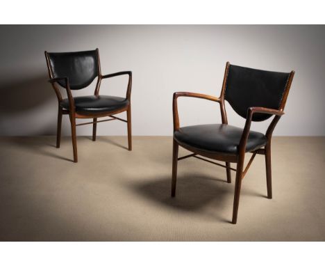 A PAIR OF ROSEWOOD 'NV46' ARMCHAIRS, BY FINN JUHL, ATTRIBUTED TO NILS VODDER,  Danish, 1960's upholstered in black leather.Pr