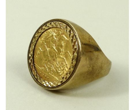 A George V 1911 gold half sovereign, mounted within a gentleman's 9ct gold ring, size T, 11.1g total weight. 