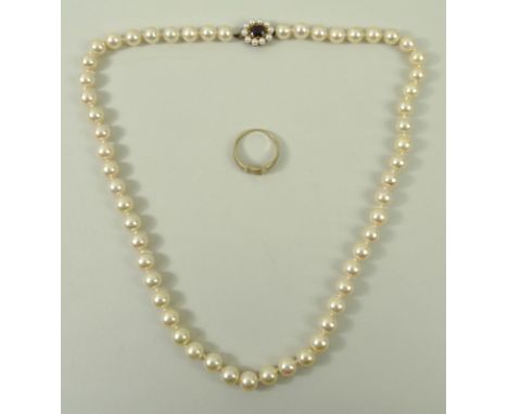 A string of fifty six cultured pearls, each approximately 10 gauge, with 9ct gold, garnet and seed pearl clasp, 32.7g, 46cm l