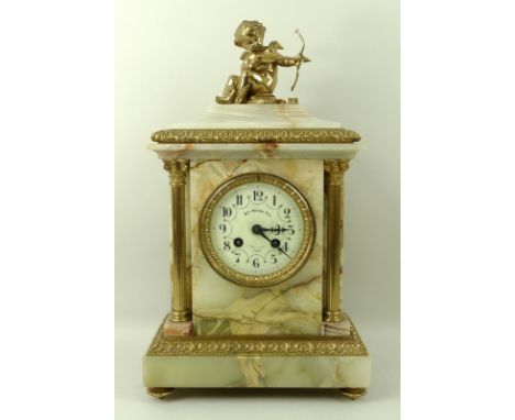A French onyx and ormolu mantel clock, 19th century, modelled with a cupid seated with a bow above the onyx case with composi