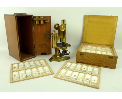 A brass microscope, R&J Beck, London 22629, in a mahogany case with three eye pieces/lenses, and a box of slides, made by Dr 