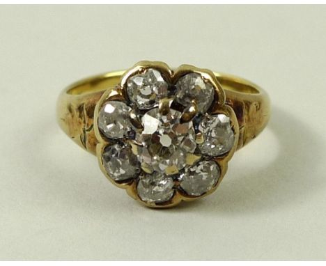 A diamond daisy cluster ring, the central old cut diamond of approximately 0.5ct surrounded by seven smaller diamonds, 2.25ct