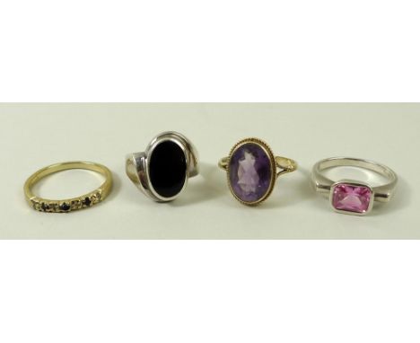 A group of rings, comprising a band set with four diamonds divided by three sapphires, size R, a ring set with an oval amethy