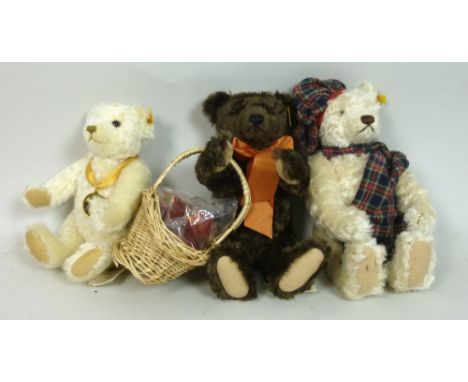 A group of bears comprising a Steiff Millennium Bear, complete with box, a Winter Teddy Bear No.35 and an Autumn Bear, both w