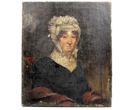 An early 19th century portrait of a lady, wearing an intricate lace mob cap and collar, and a green dress with red sleeves, o