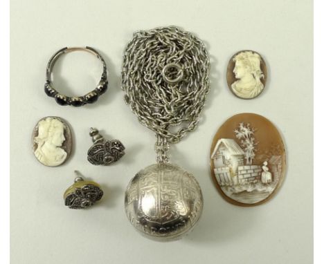 A Georgian mourning ring of five cut jet stones, engraved 'Louisa Reynolds 15 Sept 1834', together with three loose cameos, a