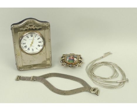 A Kitney & Co silver travelling clock, strut back, an enamel and Berlin Vaud plaque brooch, 19th century, a silver necklace, 