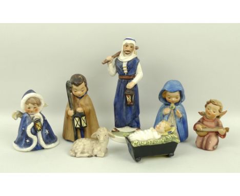 A Hummel Nativity set of seven pieces comprising Joseph, 17cm, Mary, 10cm, baby Jesus in crib, a shepherd with crook and lamp