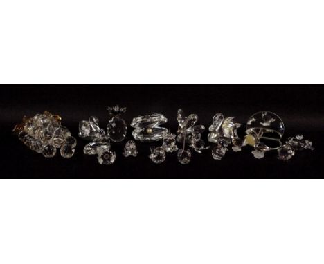 A collection of Swarovski figurines, comprising beaver, grapes, butterfly, two swans, pineapple, oyster and pearl, miniature 