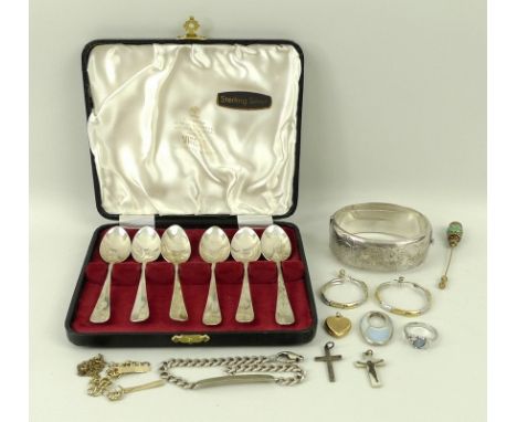 A collection of costume jewellery, comprising a silver bangle, silver ring set with a moonstone, crucifix, gold chain, togeth