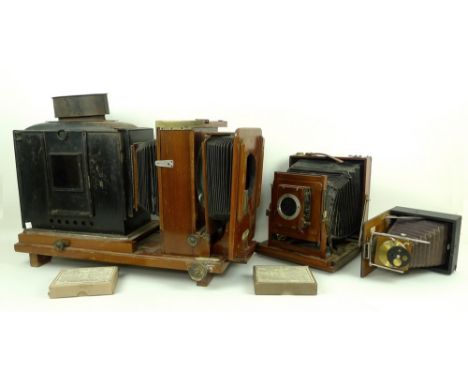 A mahogany and brass quarter plate camera, Thornton Pickard, Triple Imperial Extension, with black bellows, two boxes of Impe