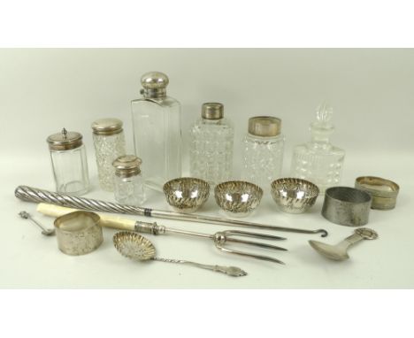 A group of four silver and cut glass dressing table items, three plated and white metal napkin rings, two glass bottles with 