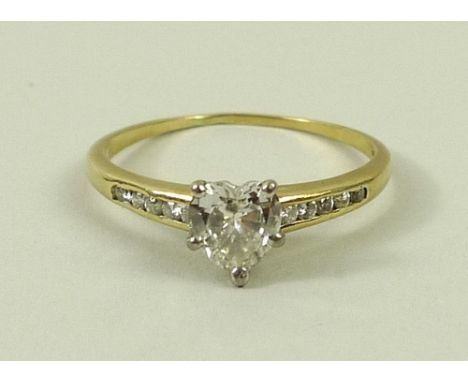 An 18ct gold and diamond solitaire ring, the heart shaped diamond approximately 1.25ct, set within a five claw mount, with fi